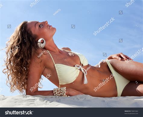 Portrait Of Relaxing Woman Lying On Sand Stock Photo 76001062 : Shutterstock