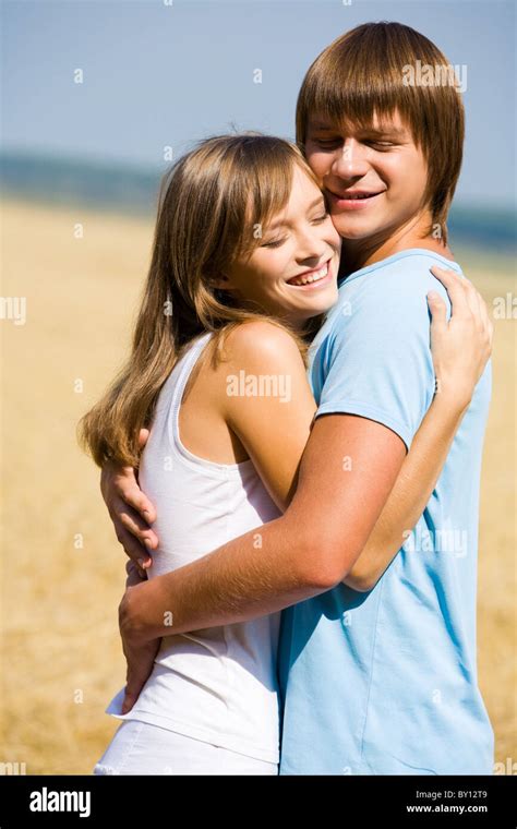 Portrait of girlfriend and boyfriend hugging each other Stock Photo - Alamy