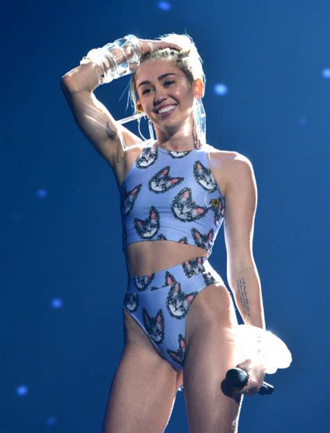 Miley Cyrus. Performing 'Wrecking Ball' at the American Music Awards ...