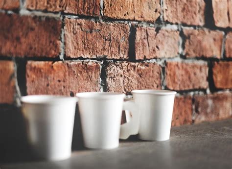Human Hand Holding Coffee Cup Morning Drinks | Royalty free stock psd mockup - 5825