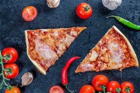 Top view of a vegetarian Pizza with vegetables and mushrooms, cut in slices - Creative Commons ...