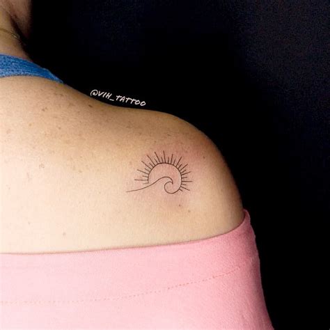 Simple Wave and Sun Tattoo on Shoulder by Vinicius Rosa