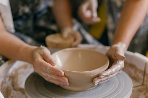 Person Shaping the Clay Using Hands · Free Stock Photo