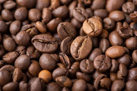 Premium Photo | Close up of roasted coffee beans aromatic dark coffee beans