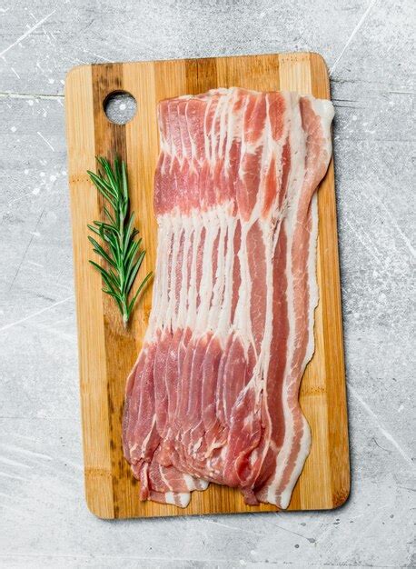 Premium Photo | Raw bacon on the board