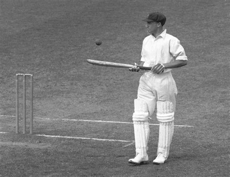 Don Bradman bounces the ball on his bat during a lull in his first-day innings of 309* at Leeds ...