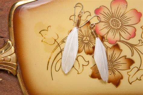 small white feather earrings by heidiroland on Etsy