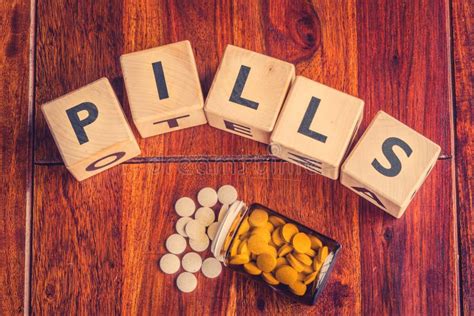 The word pills on a table stock image. Image of conceptual - 67957439