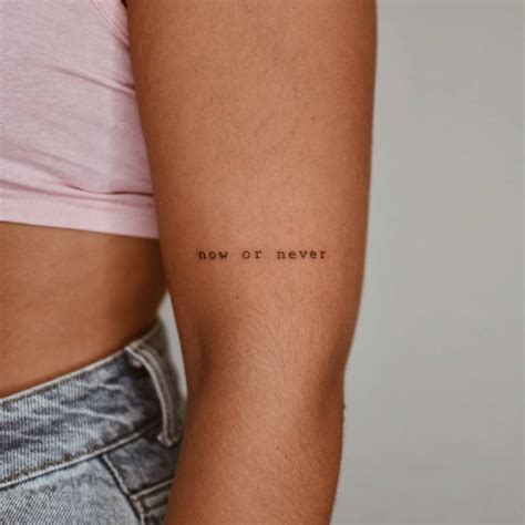 Tattoo that says "now or never" located on the upper