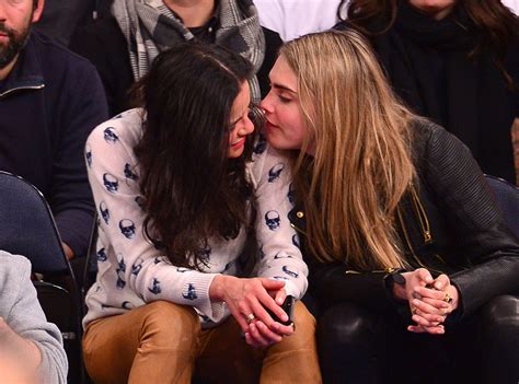 Michelle Rodriguez Gives Cara Delevingne a Sloppy Kiss at NBA Game, Then Does High Kicks With ...