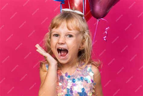 Free Photo | Annoyed little blonde girl standing with helium balloons ...