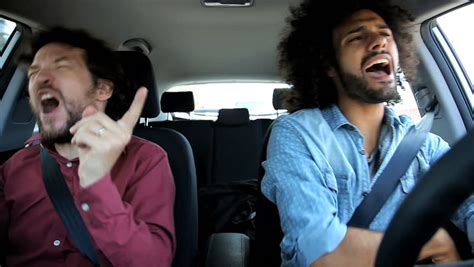 Stock video of two men in car having fun | 6089354 | Shutterstock