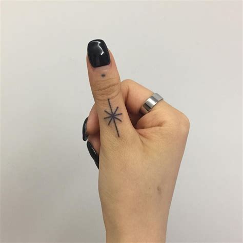 yozi handpoked tattoo. Tiny tattoo on thumb, hand. | Tiny tattoos, Tattoos, Flower tattoo