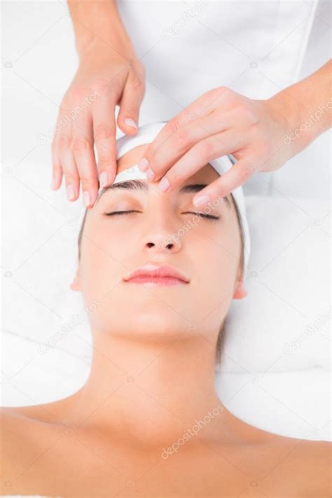 Hand waxing woman's eyebrow — Stock Photo © Wavebreakmedia #81829440