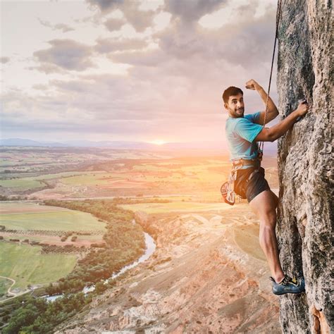 Premium Photo | Climber on wall with landscape