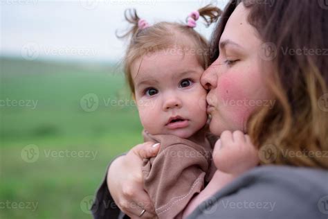 Mom, dad and daughter. Parents Hold baby by hands and go towards the camera. 6769112 Stock Photo ...