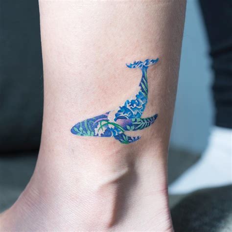 Floral blue whale tattoo - Tattoogrid.net