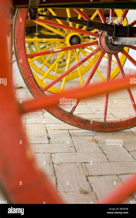 Red and yellow cart wheels, ethnographic museum, Museu Etnografico do Trajo Algarvio, Sao Bras ...