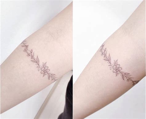 Flower armband tattoo on the right forearm.