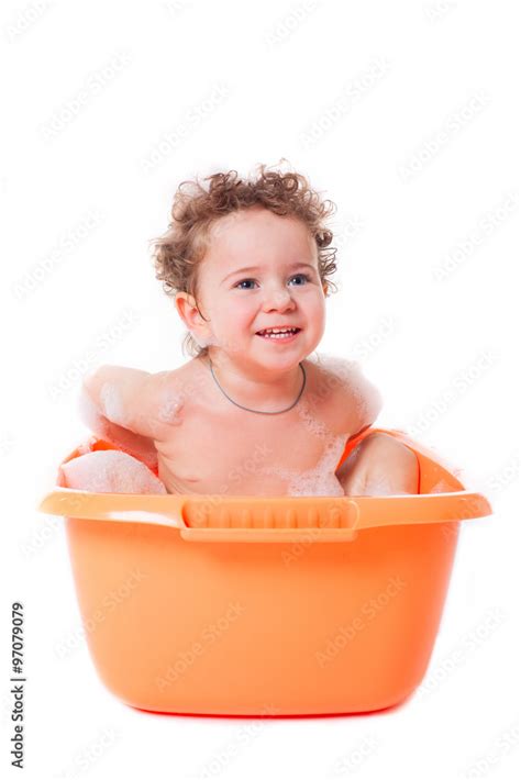 Cute happy baby playing with foam in bath Stock Photo | Adobe Stock