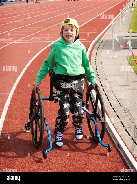 Young boy with Cerebral Palsy in walking frame on sports day Stock Photo - Alamy