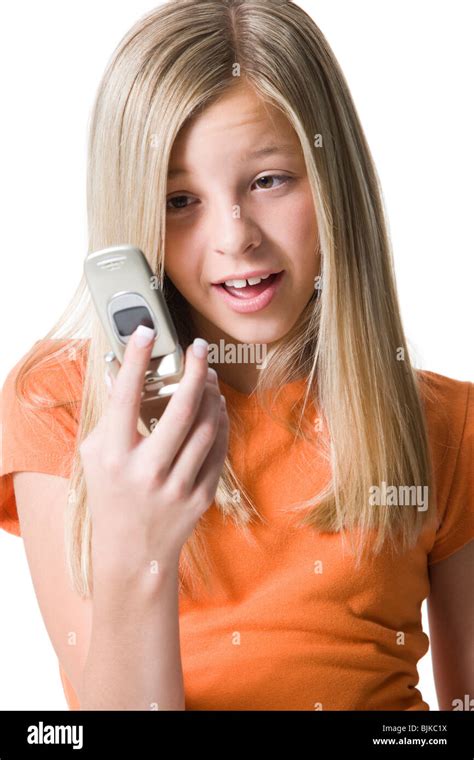 Girl looking at cell phone Stock Photo - Alamy