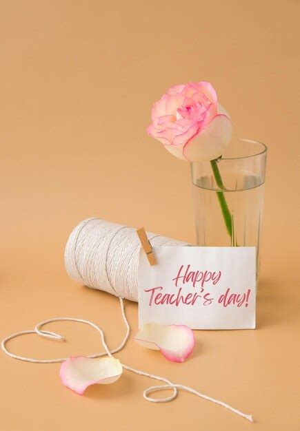 Premium Photo | Happy teachers day text tender pink roses with spool of white cotton rope in ...