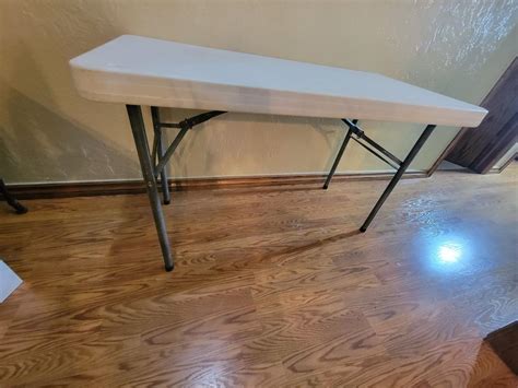 4 ft folding table | EstateSales.org