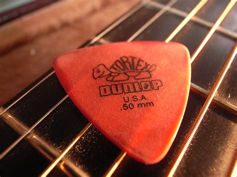 Red colored guitar pick | Toshiyuki IMAI | Flickr