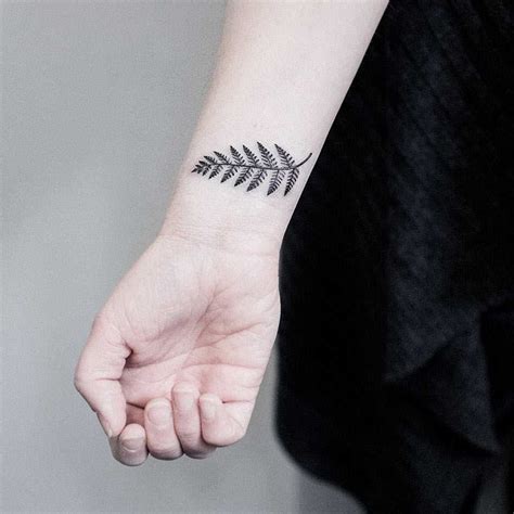 Small fern leaf tattoo on the wrist - Tattoogrid.net