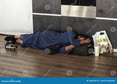 Tired Man Sleeping on Floor at Airport Terminal Editorial Photo - Image ...