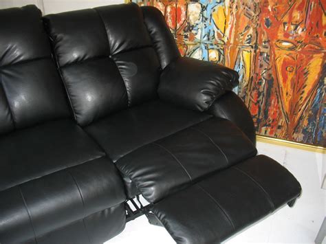 Black Couch | -Plush black vinyl couch with two recliners on… | Flickr