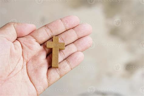 cross representing Jesus in human hand 7424678 Stock Photo at Vecteezy