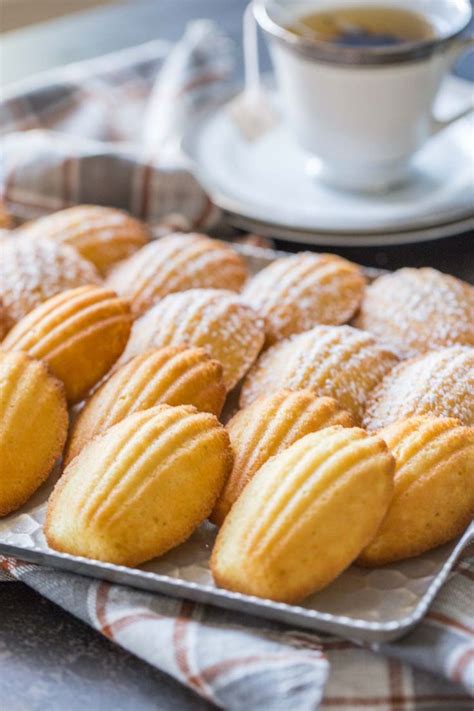 If you've never had a Lemon Vanilla Madeleine before, they are small, sweet, buttery cakes shap ...