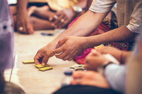 Group of balinese men playing cards sitting on the floor. … | Flickr