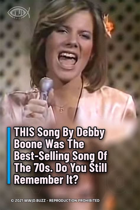 a woman singing into a microphone with the caption, this song by debby ...