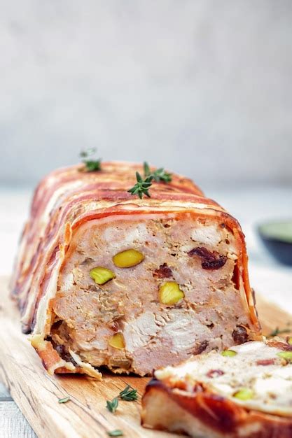 Premium Photo | Terrine of pork with pistachios cherries chicken and bacon