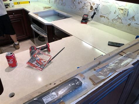 Creamy base Quartz Countertops installation | Cambria Fairbourne