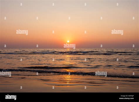 Beauty sunset on Goa beach in India Stock Photo - Alamy