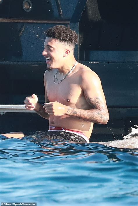 Jadon Sancho looks cosy with a mystery stunner during Ibiza yacht trip ...