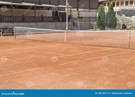 Red clay tennis court stock photo. Image of activity - 298166112