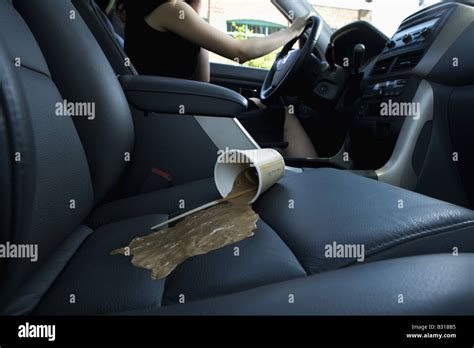 Coffee spill on passenger seat Stock Photo - Alamy