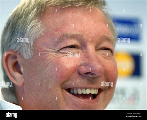(dpa) - Manchester United's soccer coach Sir Alex Ferguson smiles during a press conference in ...