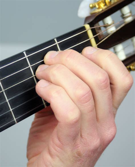 How to Play an E Minor Chord - Notes On a Guitar