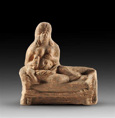 Roman hetaera leaning on a kline, 2nd-3rd century A.D. In her right hand she holds a alabastron ...