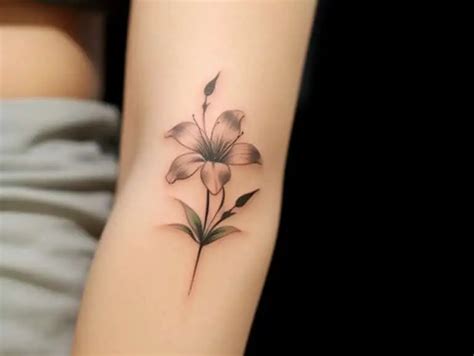 The Significance of Lily Tattoo Meanings + Designs