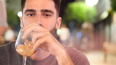 Young Man Drinking Cocktail Outside at Night Stock Footage - Video of ...