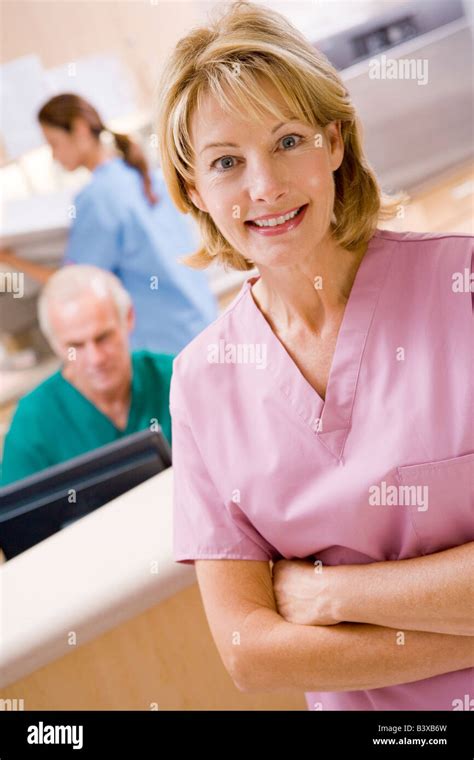 Nurses In The Reception Area Of A Hospital Stock Photo - Alamy