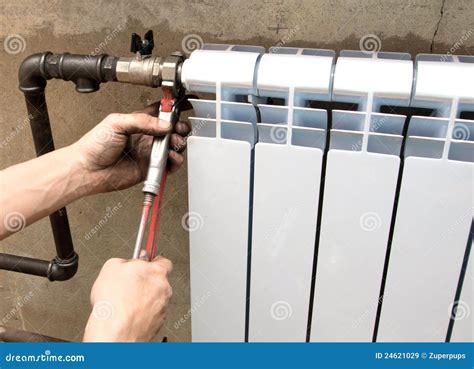 Installation of a radiator stock image. Image of natural - 24621029