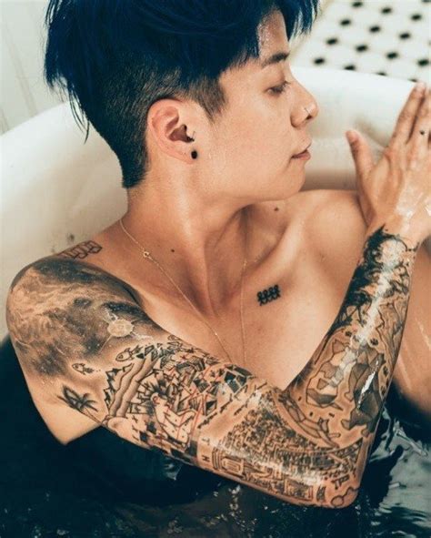 Amber shows off her arm of tattoos